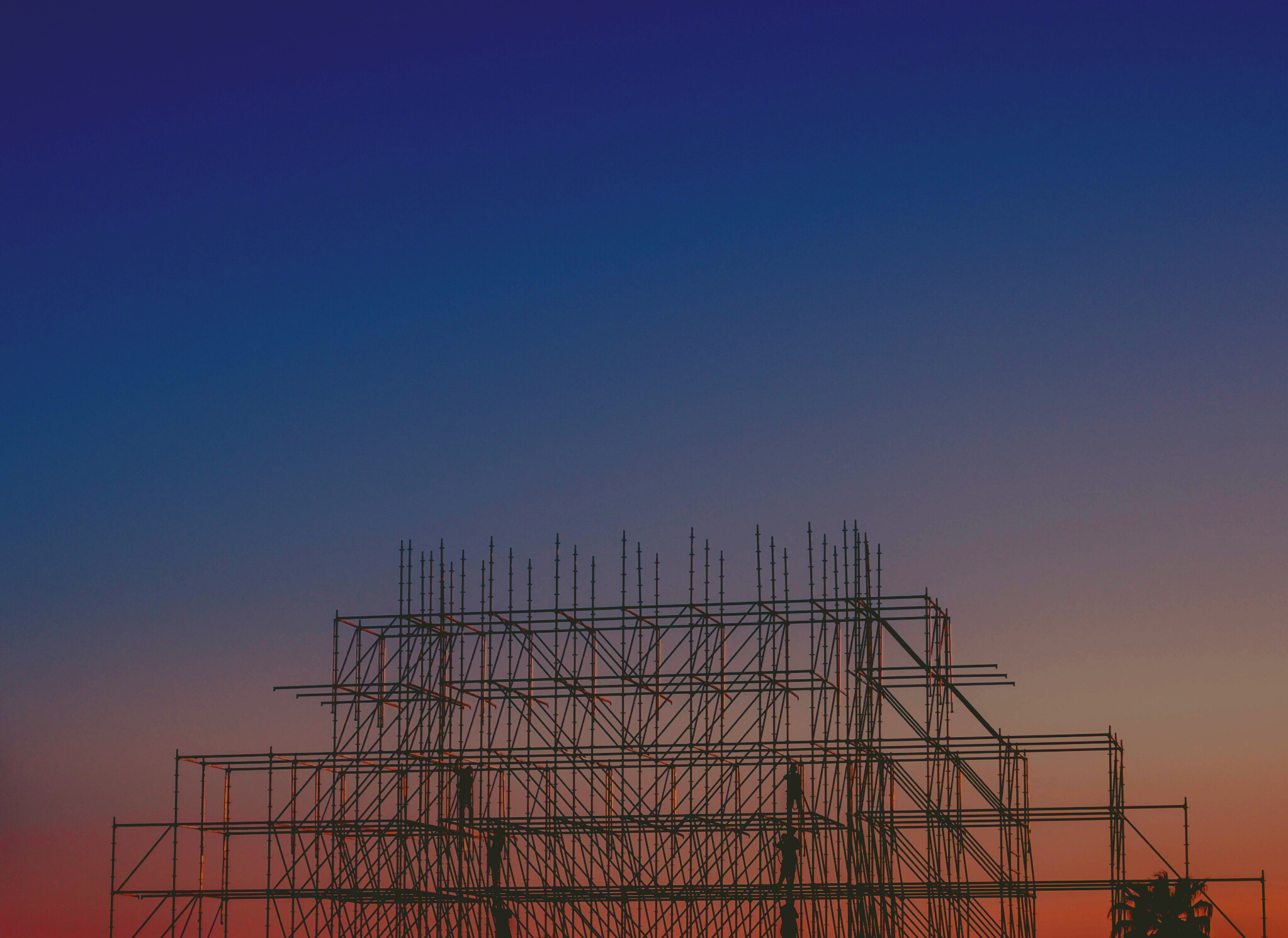 Photo of People on Building Under Construction